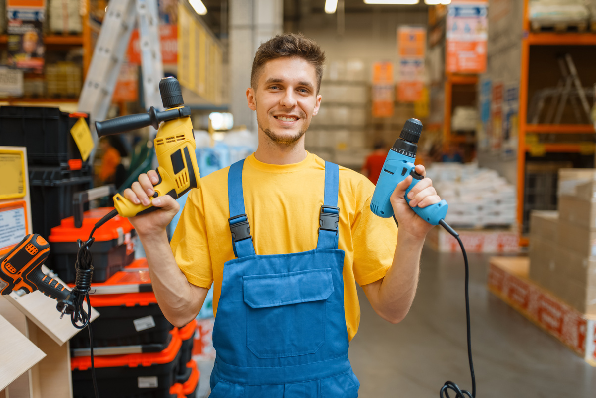 Male Builder with Power Tools in Hardware Store